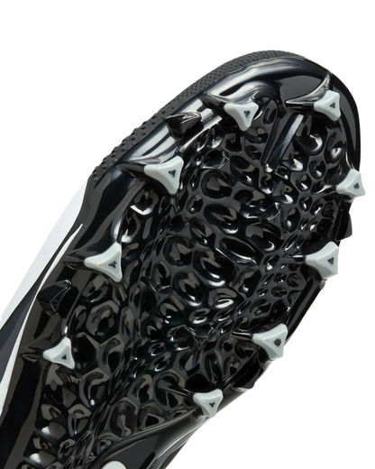 Close-up of Nike Alpha Menace Varsity 4 cleat black and white outsole with triangular cleats for traction