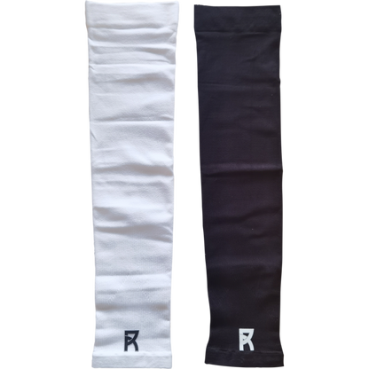 Pair of Reyrr Compression Arm Sleeves in white and black, breathable and elastic for UV protection and sweat wicking